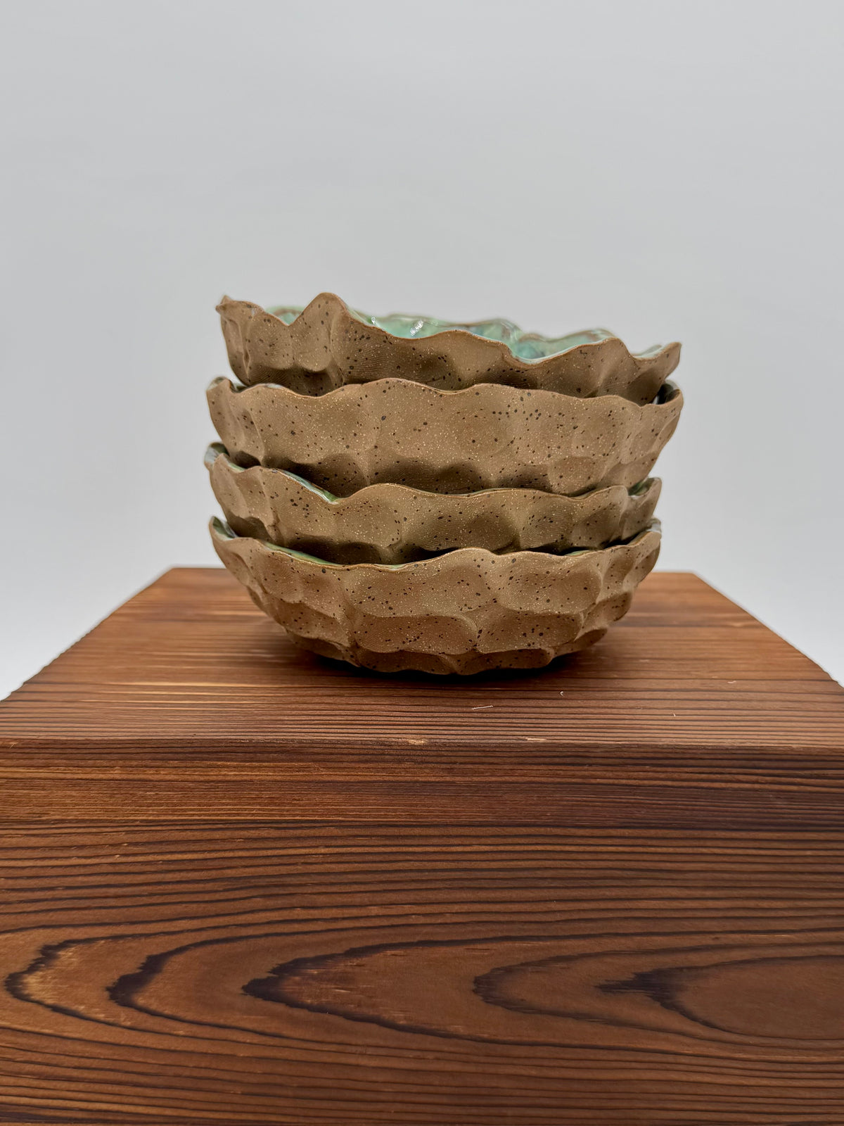Stack of four coordinating Woodland Tide bowls