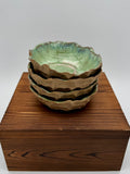 Four coordinating bowls shown together; individual listing includes one bowl